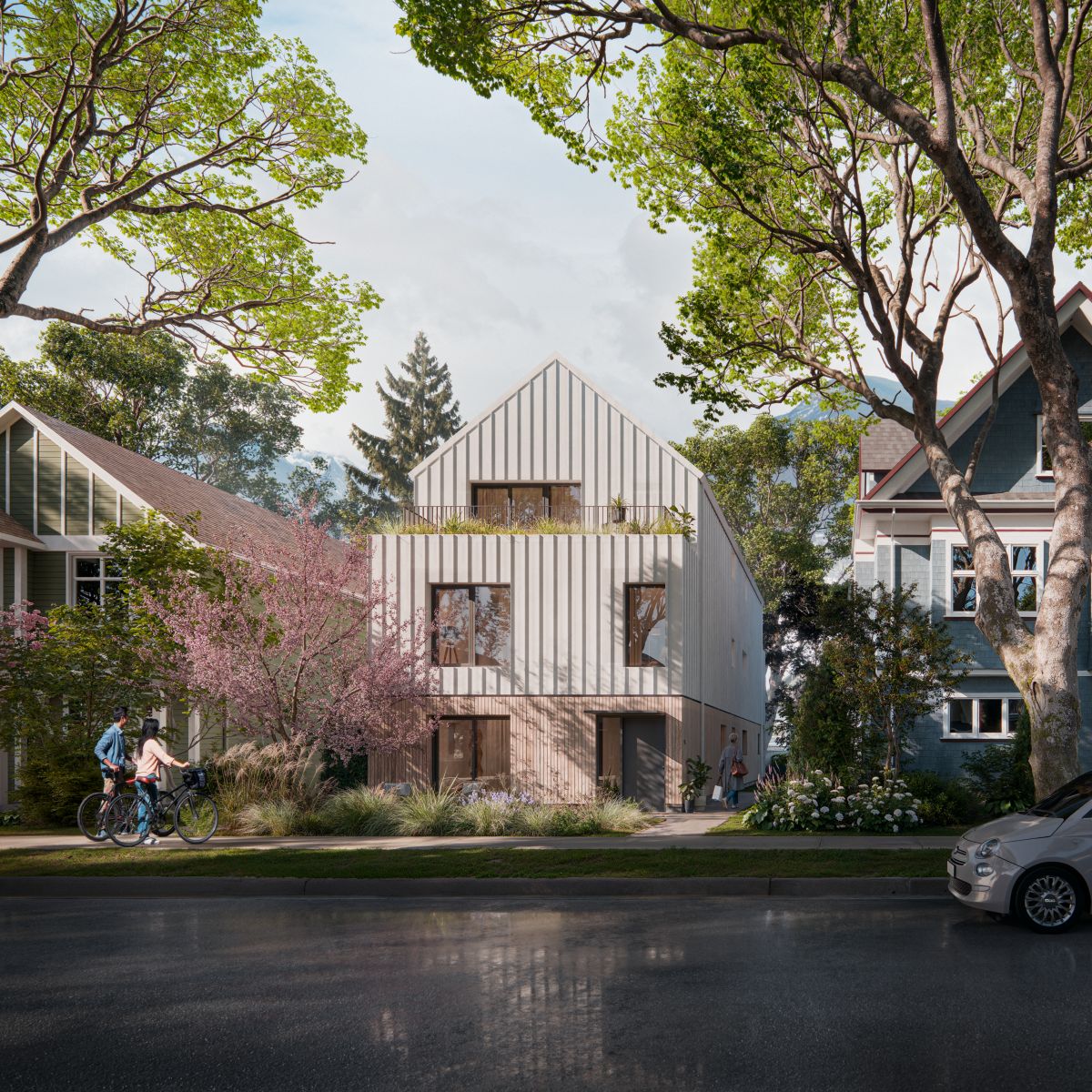Rendu 3D d’un immeuble doté d’un toit à pignon et de bardage vertical, dont la conception se marie à l’environnement naturel. Il y a de grandes fenêtres, une terrasse au deuxième étage et de la verdure.